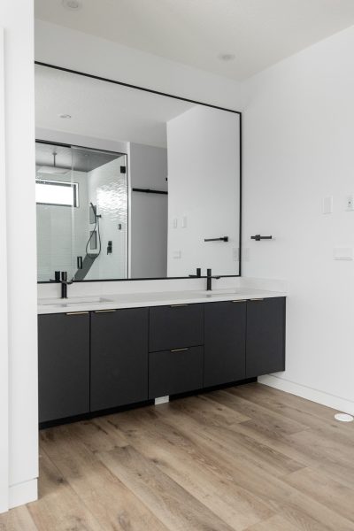 Dark floating vanity in a modern Edmonton ensuite